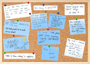 The words of children and young people shown as post-it notes on a board